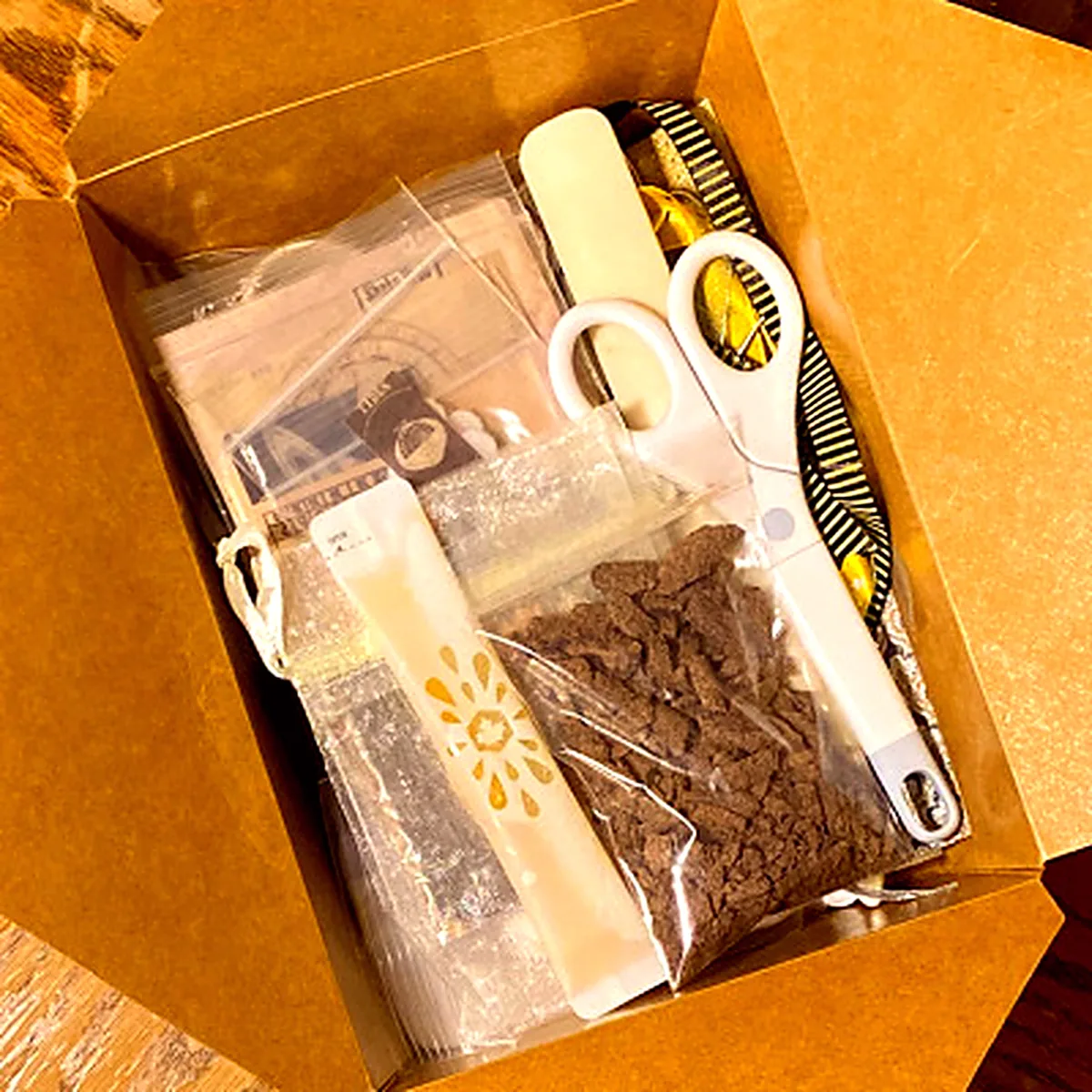 Scrapbooking kit contents laid out by hand